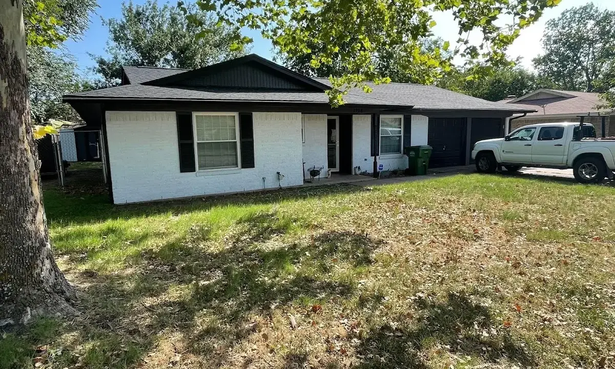 Professional roofing crew working on a residential roof in Harrodsburg